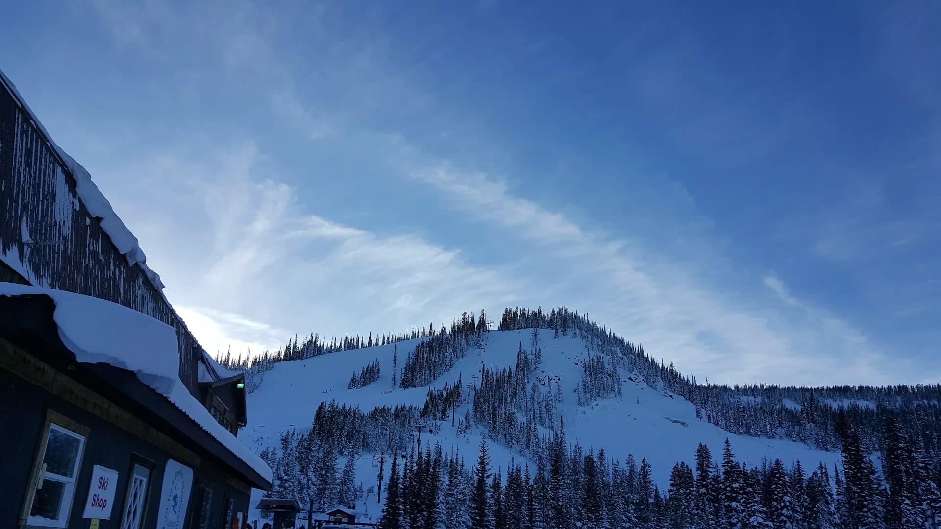 Lodge and snowy slopes at Lost Trail Powder Mountain